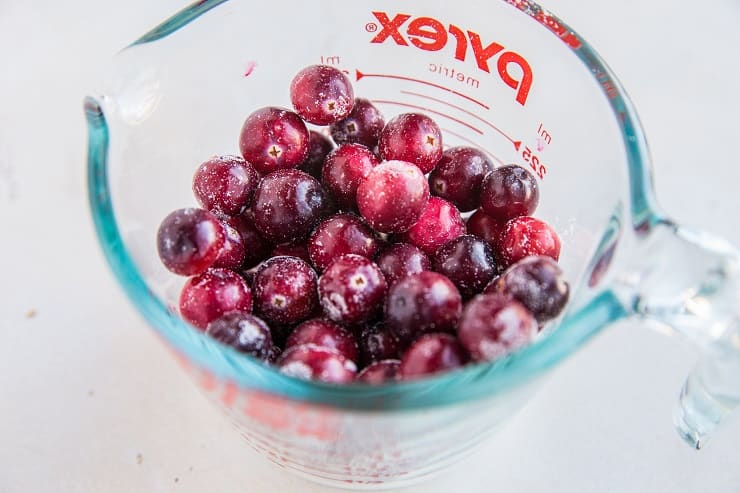 Toss cranberries in coconut flour