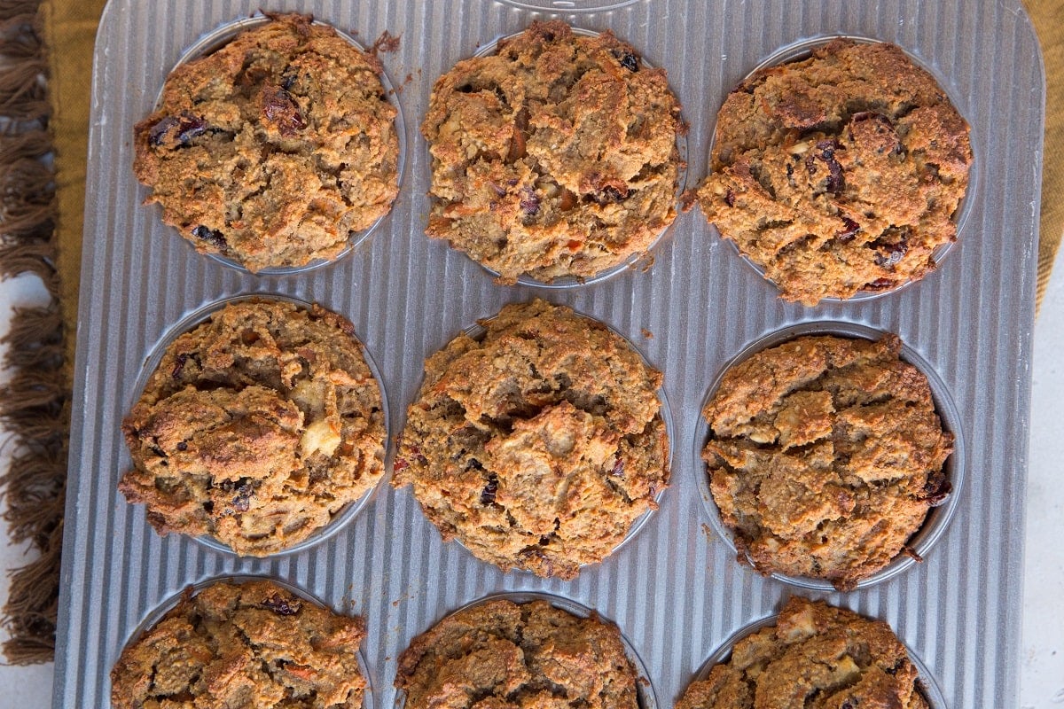 Muffin tray full of healthy carrot cake muffins