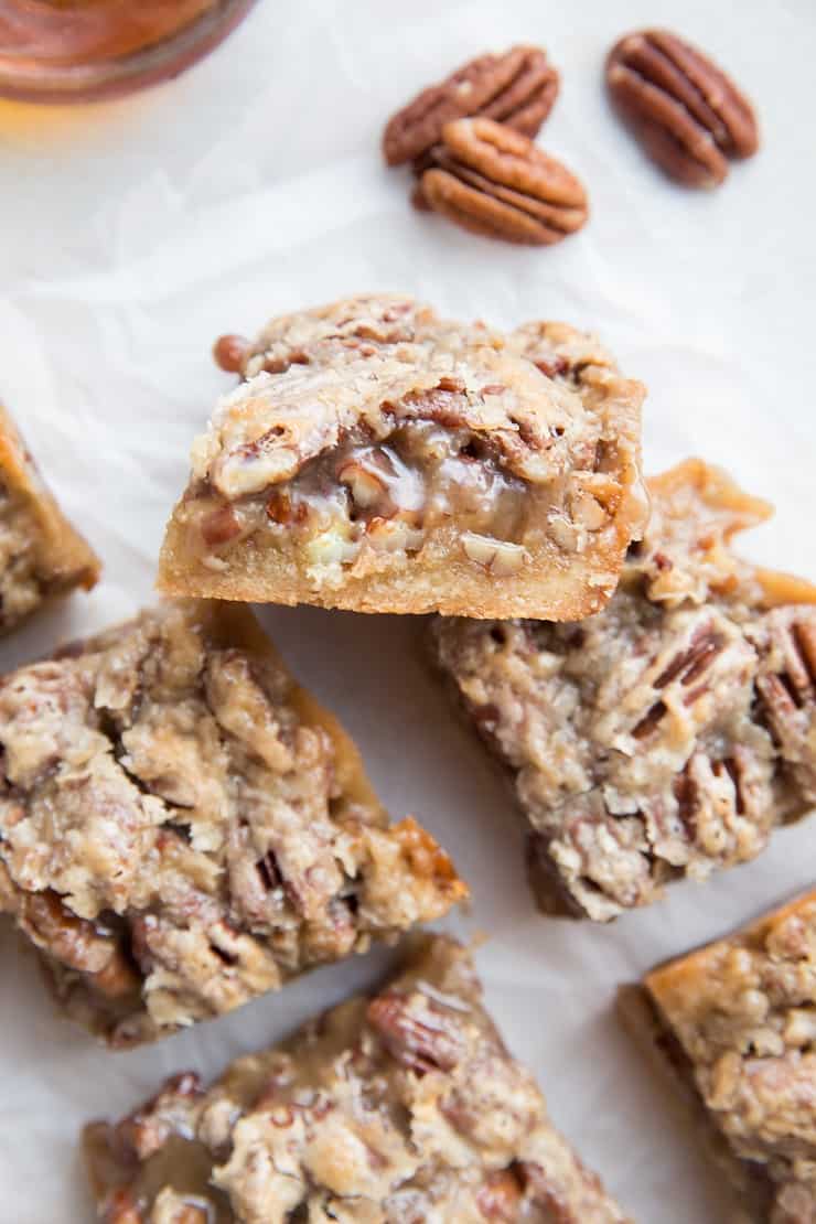 Vegan Paleo Pecan Pie Bars - gooey caramel pecan bars on shortbread crust - an amazing healthier dessert recipe that is grain-free, dairy-free, gluten-free and delicious! No eggs or gluten!