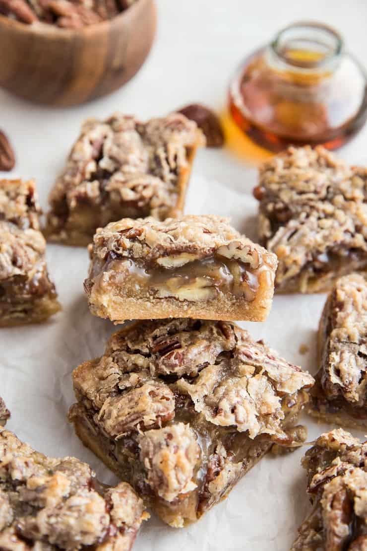 Grain-Free Vegan Pecan Pie Bars that are paleo, dairy-free, refined sugar-free and healthier. A delicious gooey caramel pecan bar on a shortbread crust