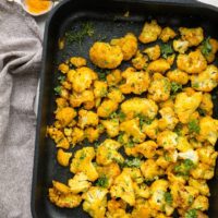 Turmeric Roasted Cauliflower - an easy superfood side dish with cauliflower, turmeric, garlic powder, liquid aminos and sriracha for a flavorful vegan, paleo, keto side dish