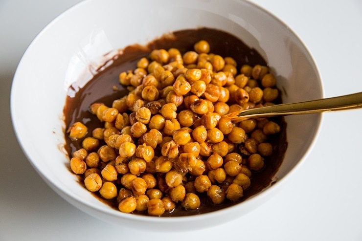 Bowl of melted chocolate with roasted chickpeas