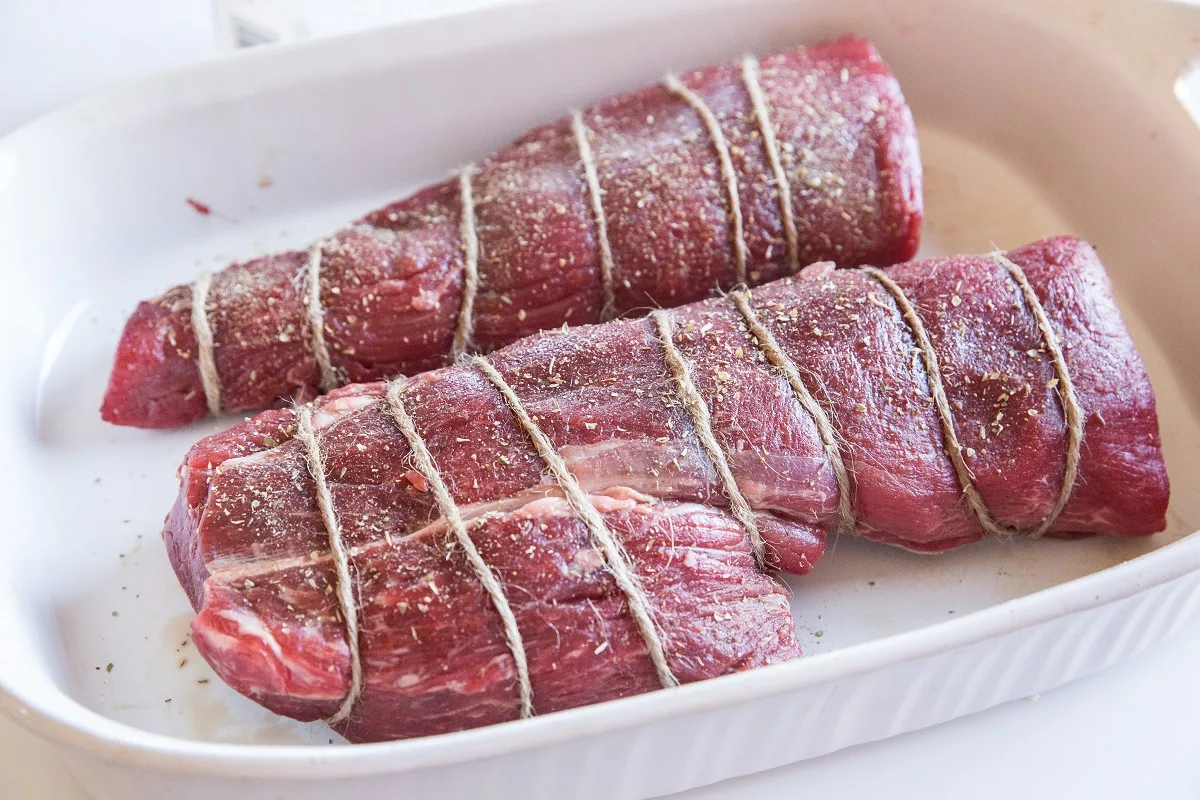 Wrap beef tenderloin with string for even cooking