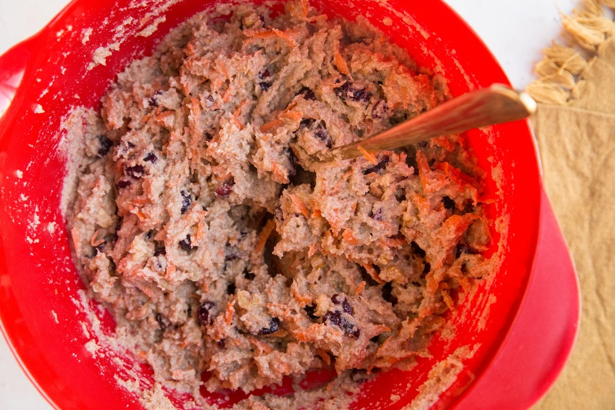 Paleo Carrot Cake Muffin batter in a red mixing bowl
