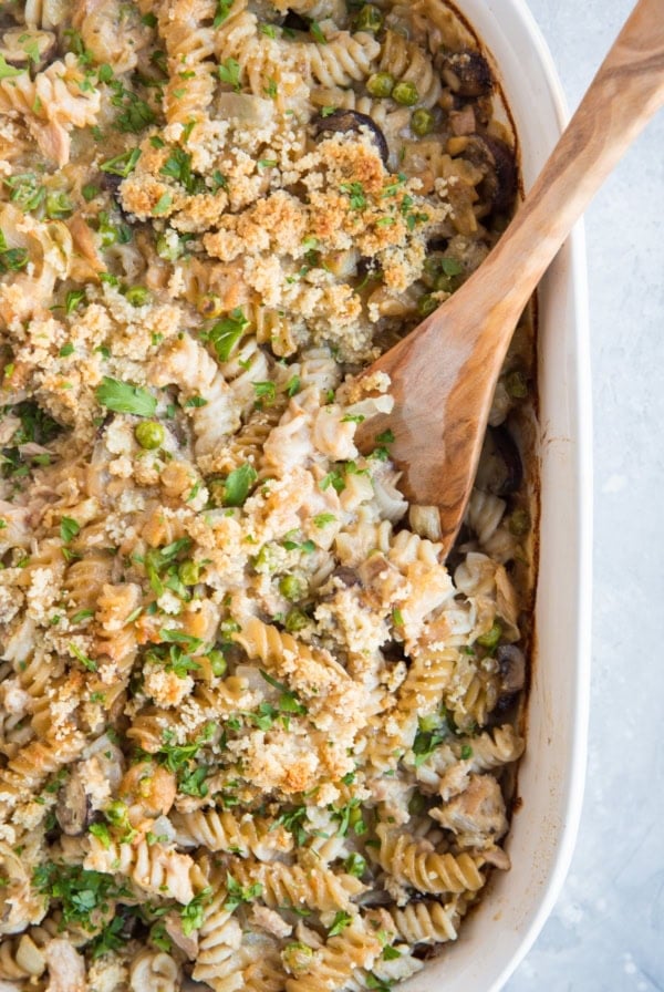 Tuna Casserole in a large white casserole dish with no milk or cream, made with gluten-free spiral pasta noodles. Healthy delicious casserole recipe