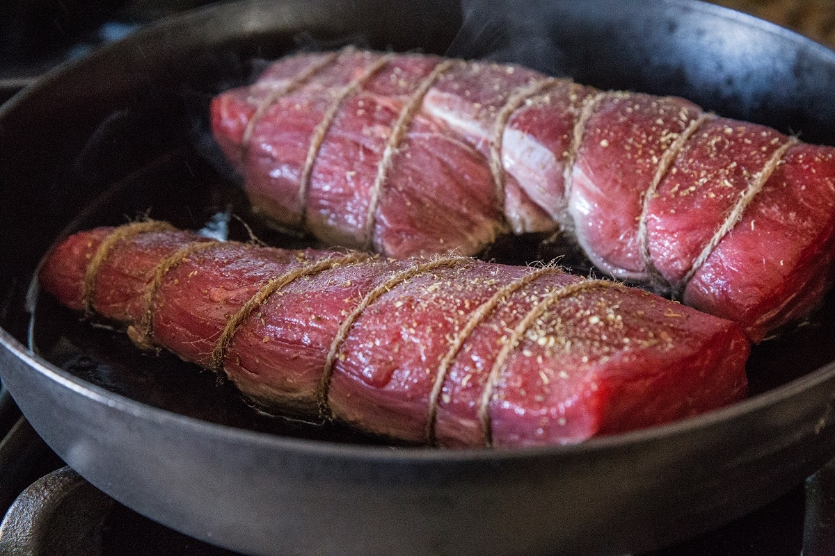 Sear beef tenderloin in the cast iron skillet before roasting 