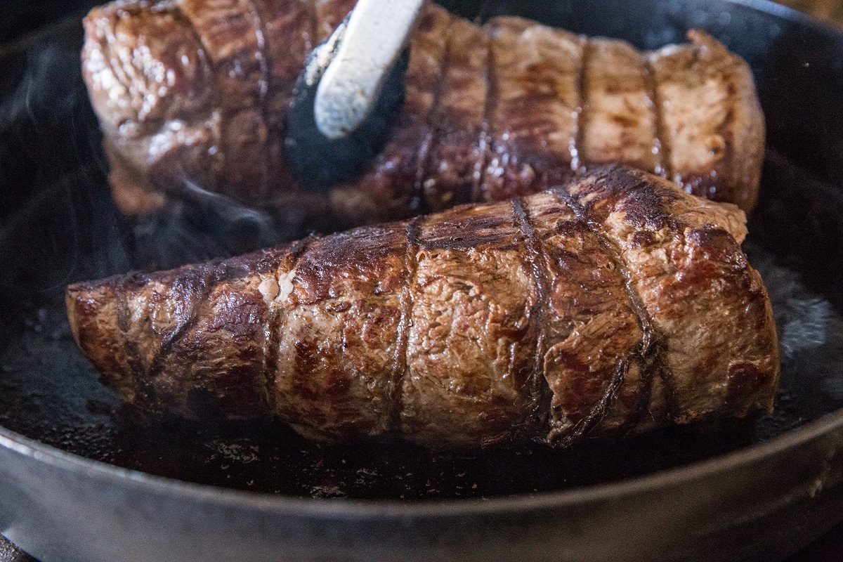 Sear beef tenderloin in the cast iron skillet before roasting in the oven