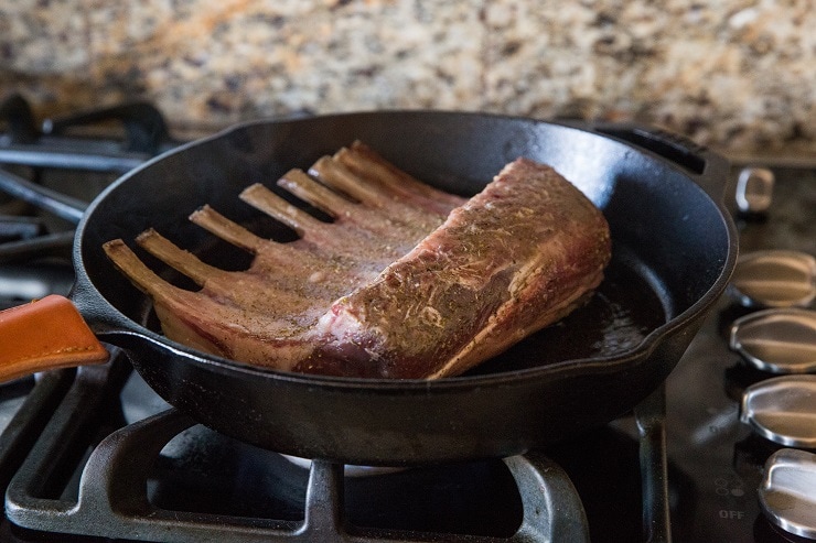 sear rack of lamb in cast iron before roasting in the oven