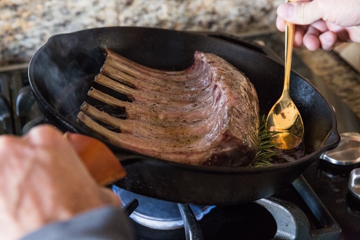 Baste the lamb with seasonings, juices and fat