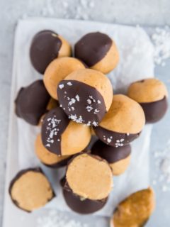 Keto Peanut Butter Buckeyes - easy chocoalte-covered peanut butter balls are an amazing homemade candy to share with friends and family. Easy, healthy, sugar-free, low-carb dessert recipe