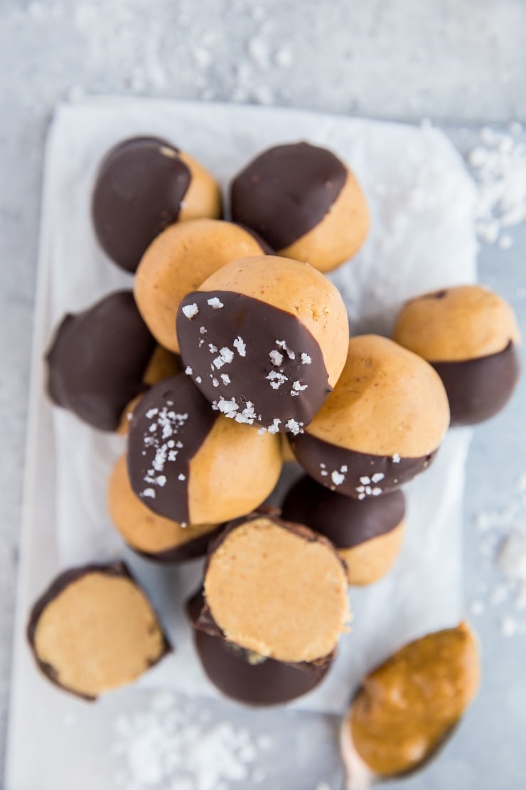 Keto Peanut Butter Buckeyes - easy chocoalte-covered peanut butter balls are an amazing homemade candy to share with friends and family. Easy, healthy, sugar-free, low-carb dessert recipe