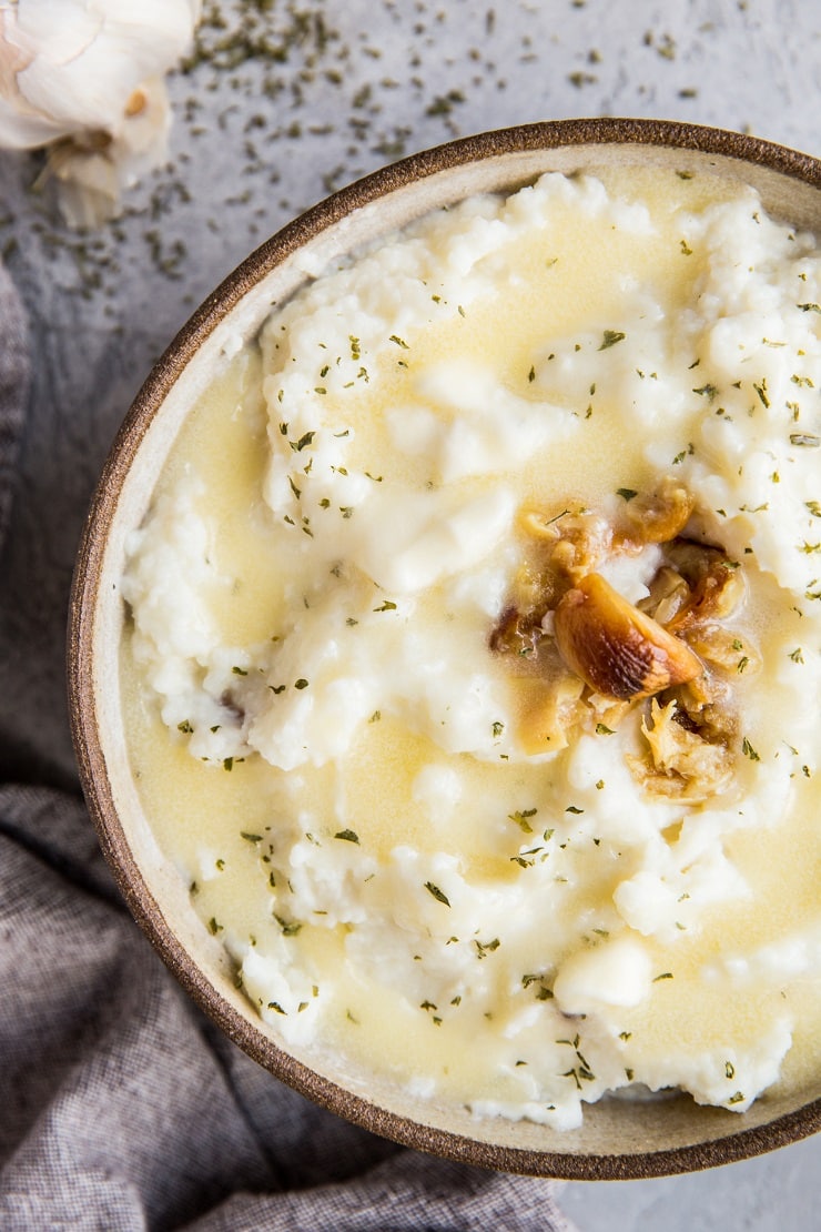 Roasted Garlic Cauliflower Mash - easy mashed cauliflower with delicious roasted garlic is a creamy, healthy side dish that is low-carb and keto. Make it to replace mashed potatoes for a lower-carb option!