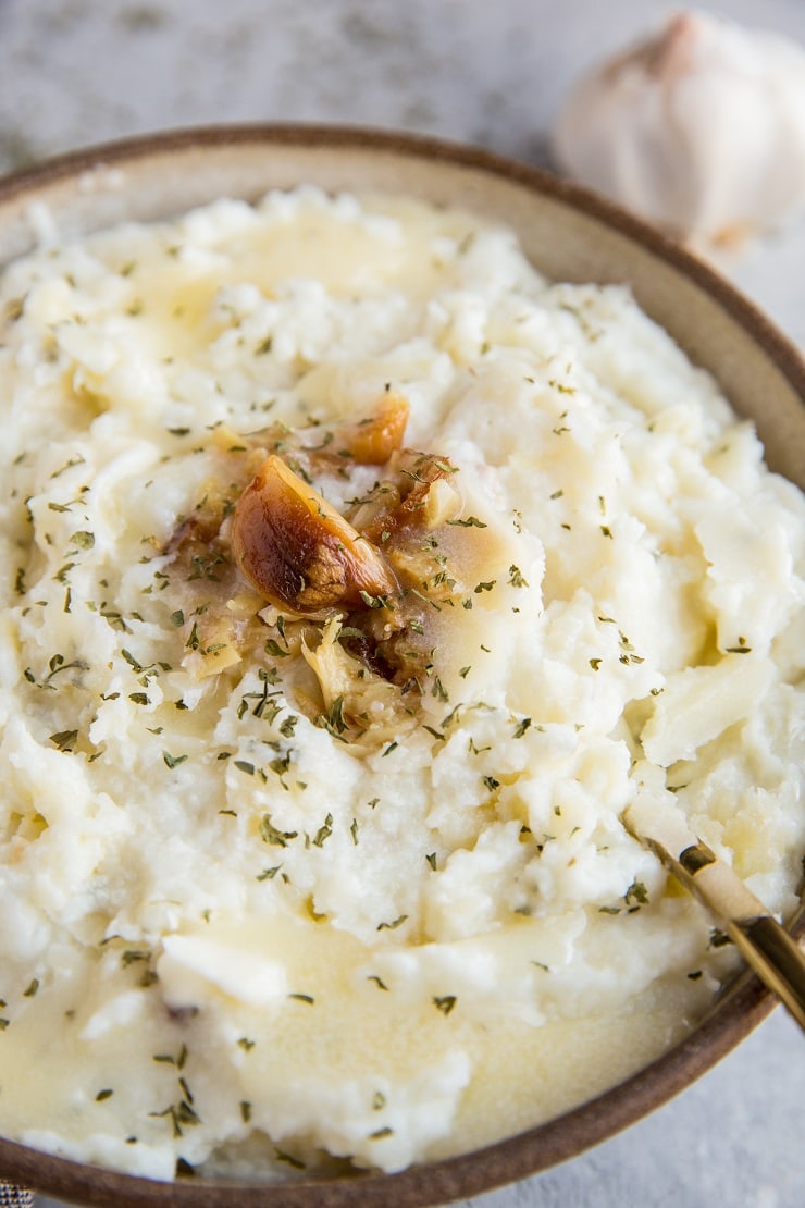 Mashed Cauliflower with Roasted Garlic - keto, low-carb, healthy replacement for mashed potatoes. This creamy cauliflower mash is easy to prepare and a great side dish to any meal!