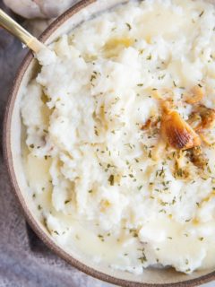 Easy Mashed Cauliflower with roasted garlic - creamy mashed cauliflower is a low-carb keto replacement for mashed potatoes. Healthy, flavorful, delicious!