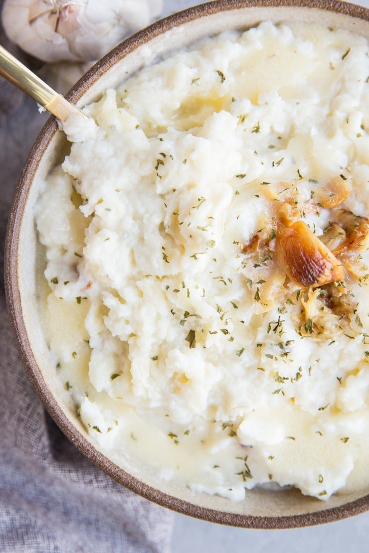 Easy Mashed Cauliflower with roasted garlic - creamy mashed cauliflower is a low-carb keto replacement for mashed potatoes. Healthy, flavorful, delicious!