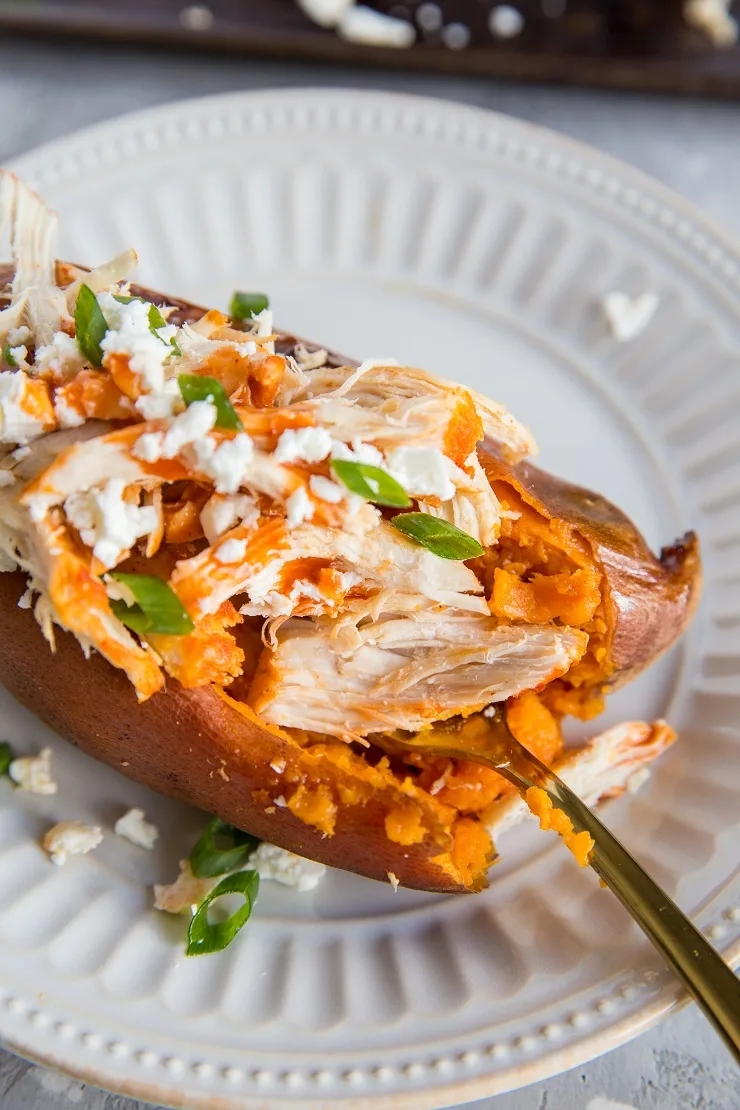 Buffalo Chicken Stuffed Sweet Potatoes with feta and green onion - an easy, healthy dinner recipee
