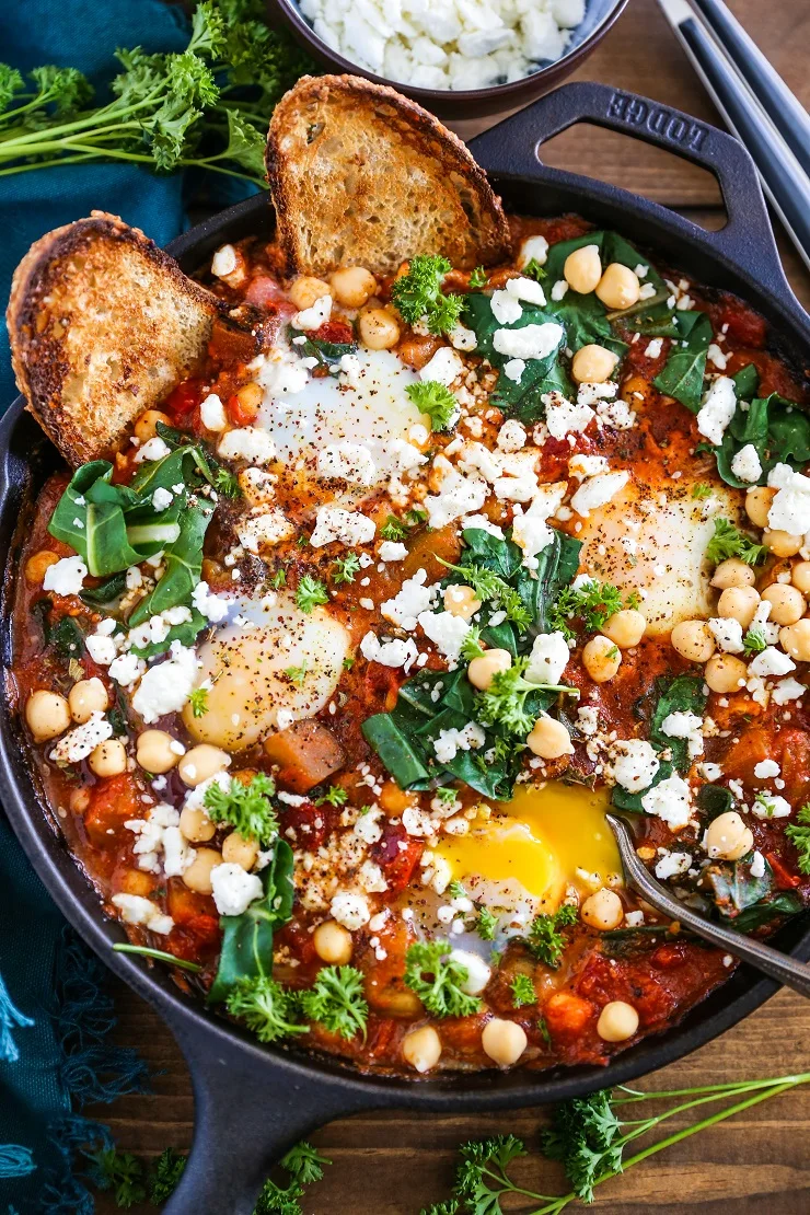 Eggplant Chickpea and Chard Shakshuka - a healthy delicious poached eggs in tomato sauce recipe. 