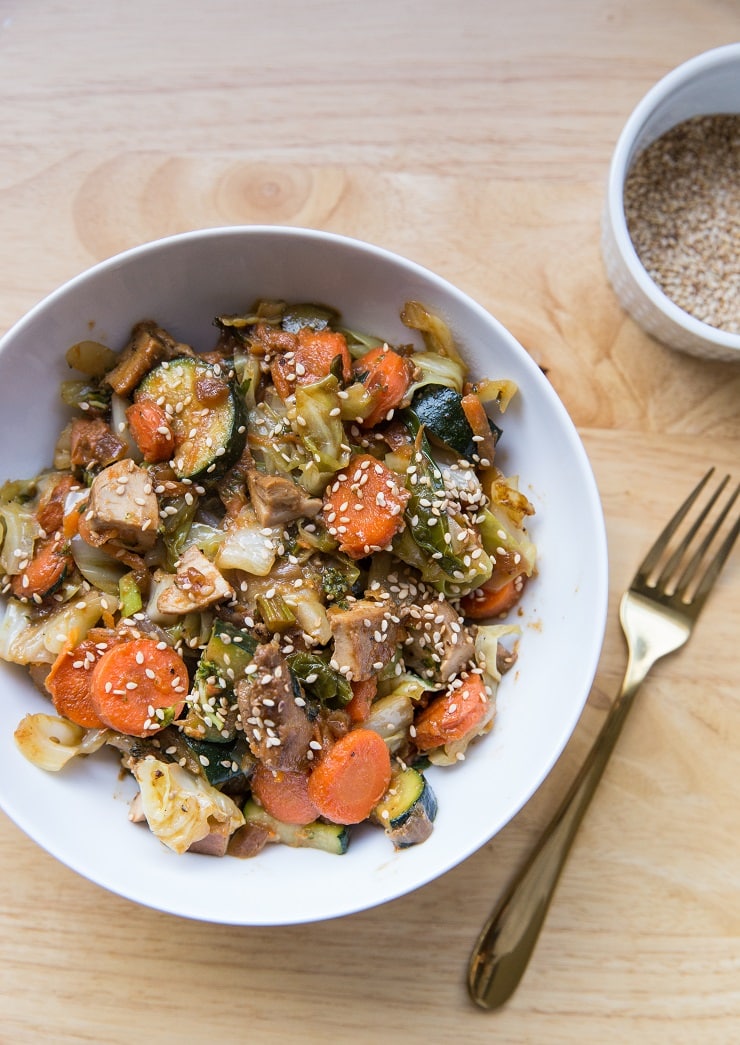 Chicken Egg Roll in a Bowl with vegetables - a healthy dinner recipe with marinated chicken, cabbage, ginger, garlic, carrots, and zucchini