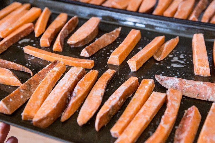 Spread sweet potatoes on baking sheets