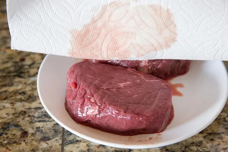 Pat filet mignon dry with a paper towel