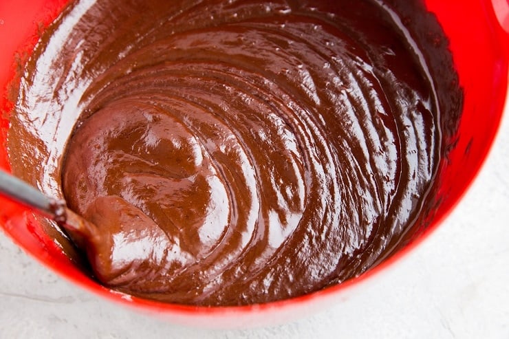 Add the chocolate mixture to the mixing bowl with the whisked eggs