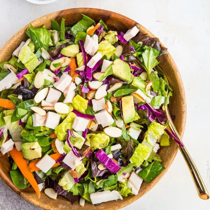 Sesame Turkey Avocado Chopped Salad with ginger sesame dressing and sliced almonds. A healthy, filling salad dressing recipe - paleo, whole30, low-carb, nutritious.