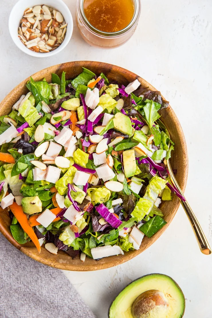 Sesame Turkey Avocado Chopped Salad with ginger sesame dressing and sliced almonds. A healthy, filling salad dressing recipe - paleo, whole30, low-carb, nutritious.