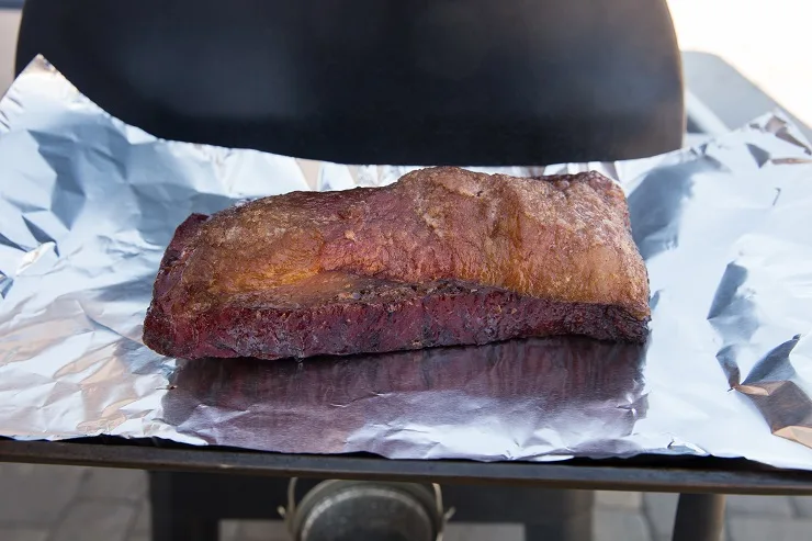 Double wrap the brisket in foil and smoke for another few hours