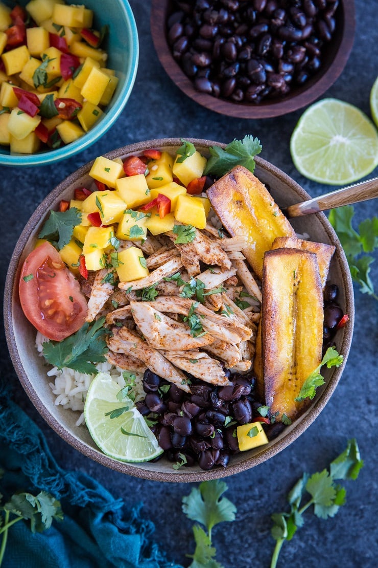 Jamaican Jerk Chicken Bowls with black beans, mango salsa, coconut rice, and fried plantains