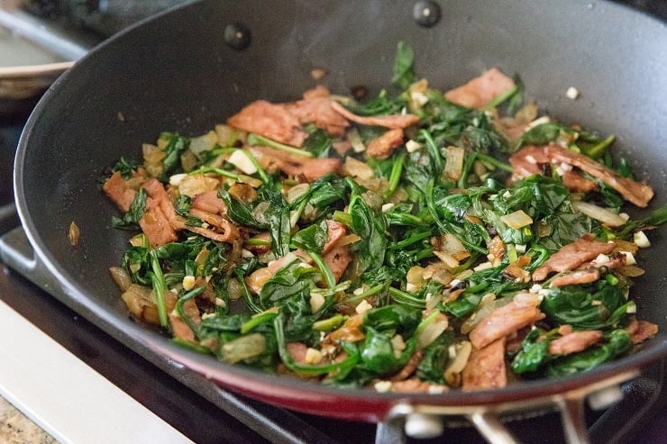 Sauteed onions, spinach and bacon for quiche