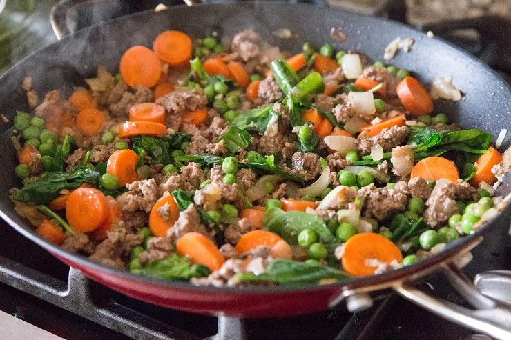 Sauté the meat and vegetables in a skillet