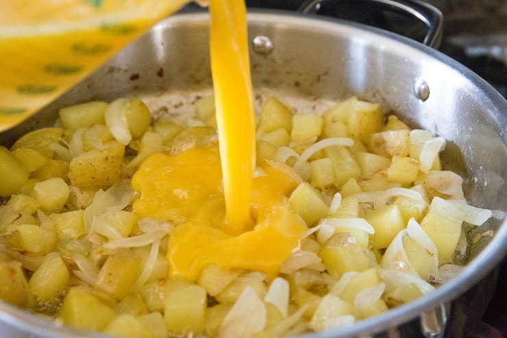 Pour the beaten eggs into the skillet