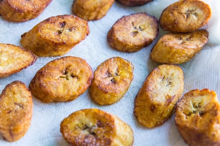 Move the fried plantains to a plate and sprinkle with salt