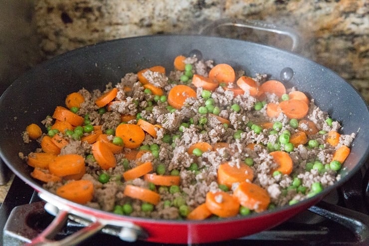 Ground beef with vegetables in a skillet