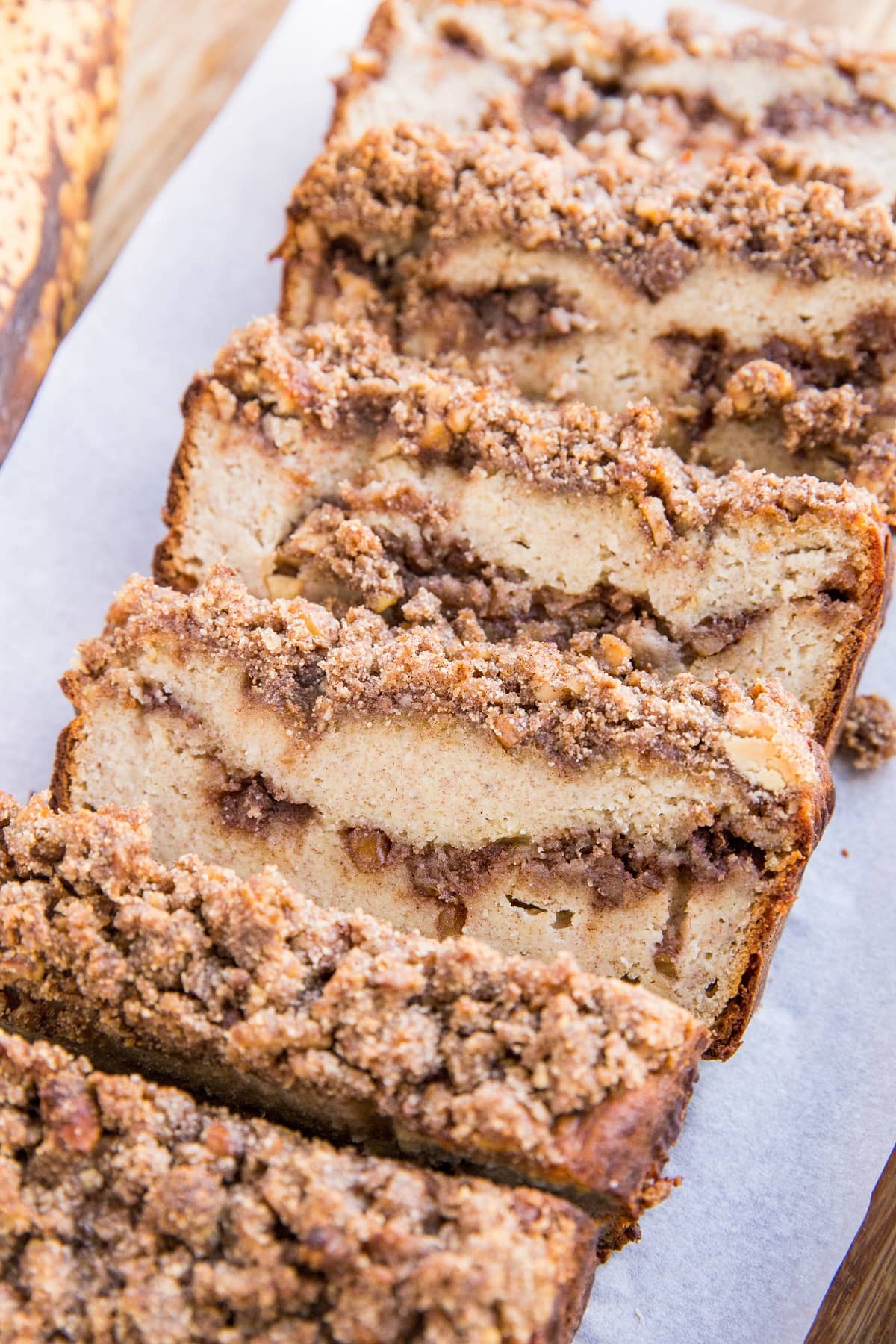 Paleo Cinnamon Swirl Banana Bread - Grain-Free, dairy-free, refined sugar-free healthy banana bread with streusel topping. Delicious gluten-free recipe for breakfast or snack.