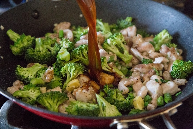 Stirring in the mongolian sauce with broccoli and ginger