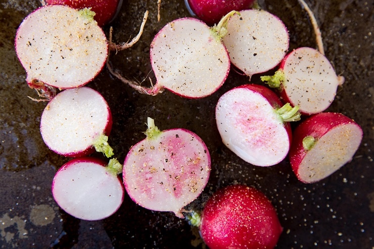 Season the radishes with sea salt, pepper, and garlic powder