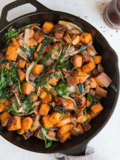 Sweet Potato Hash Recipe with bacon, onion, and spinach. This easy breakfast recipe results in perfectly crispy potatoes