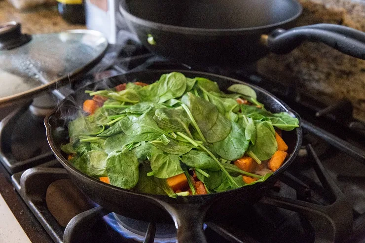 Cook the spinach into the hash