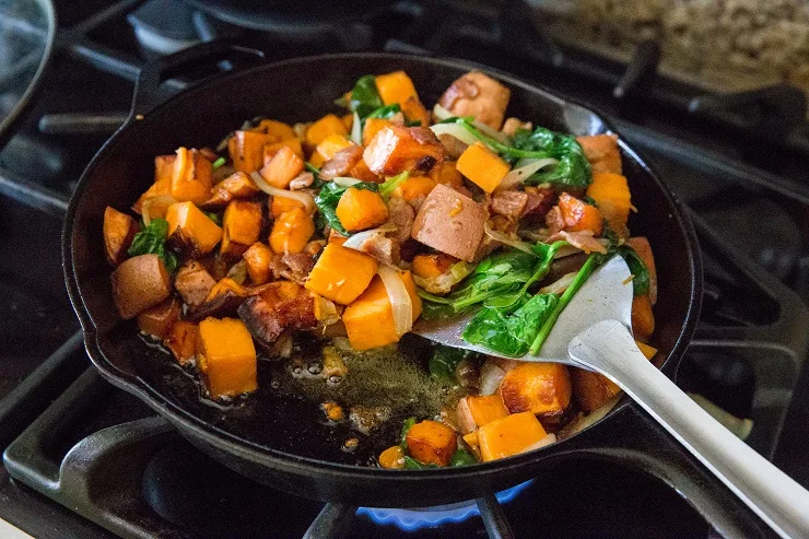 Stir the spinach into the hash and continue cooking until potatoes are cooked through