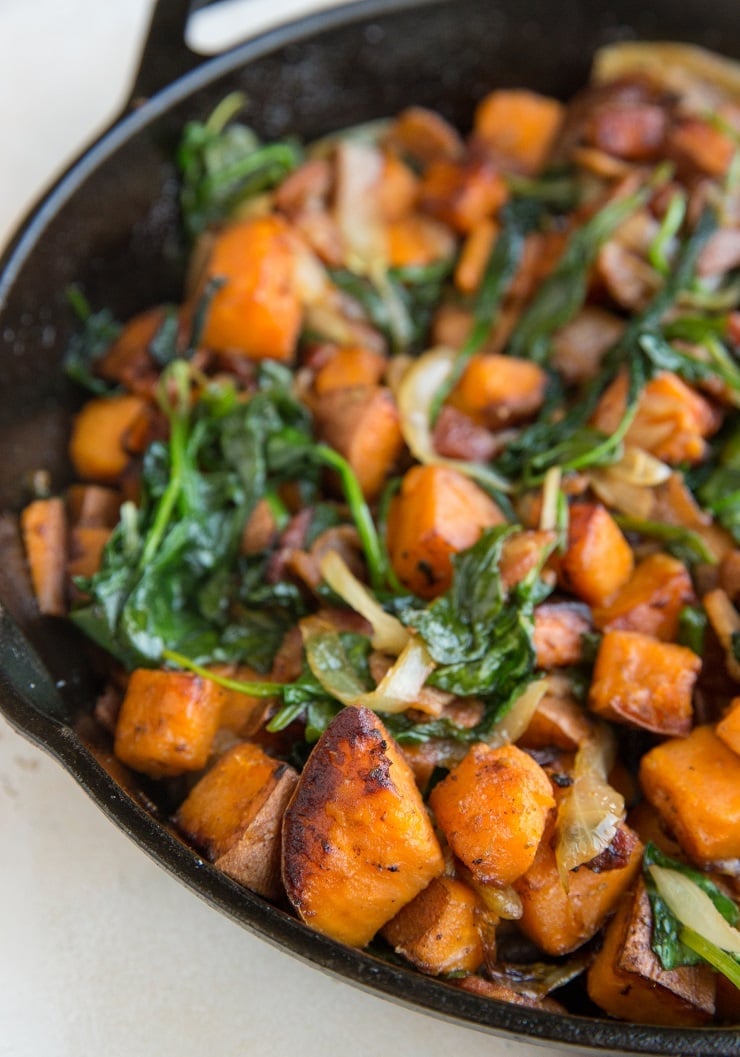 Sweet Potato Hash Recipe with bacon, onion, and spinach. This easy breakfast recipe results in perfectly crispy potatoes