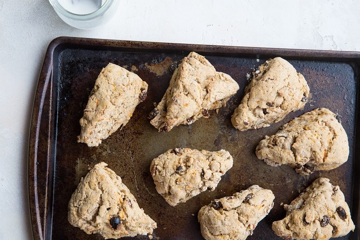 Finished carrot cake scones on a baking sheet