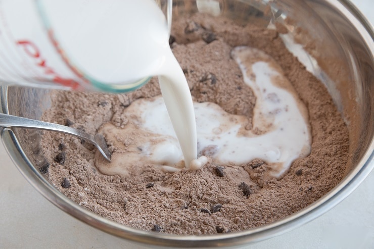 Pour the coconut milk into the mixing bowl to mix the scone dough