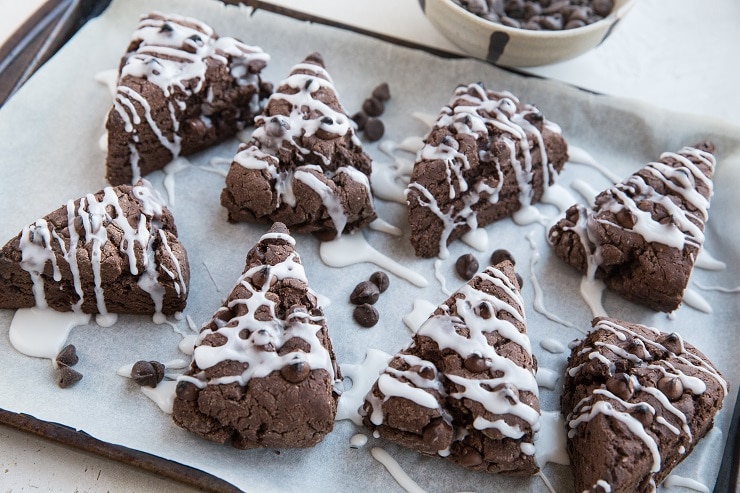 Scones on a baking sheet with glaze