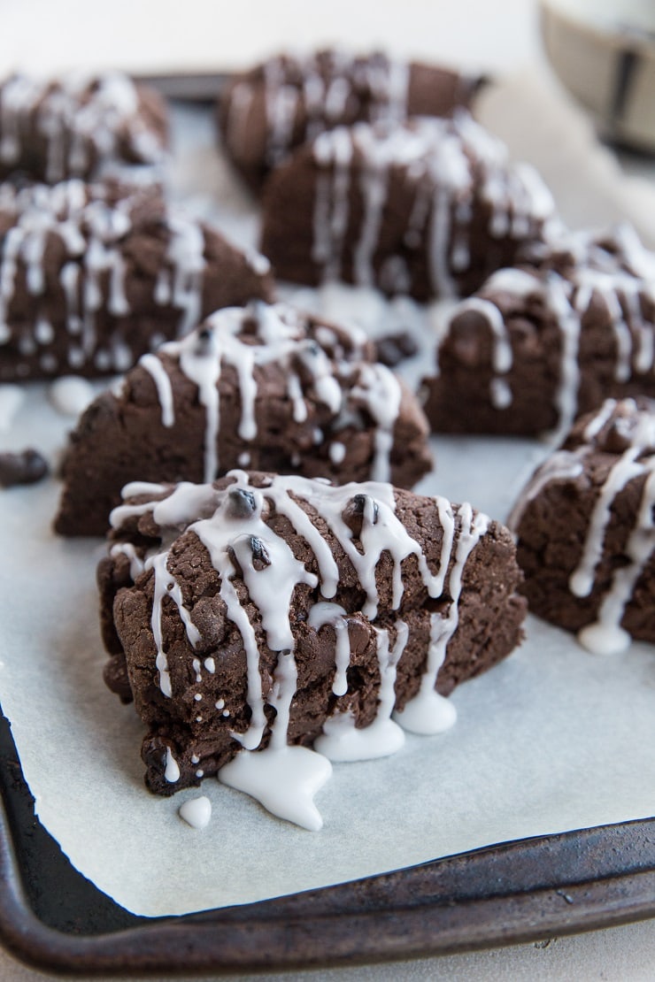 Gluten-Free Vegan Chocolate Scones with chocolate chips and an easy glaze. These delicious scones are perfect for sharing with family for brunch