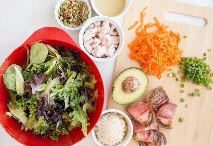 Ingredients for a delicious vegetable packed chicken salad with avocado