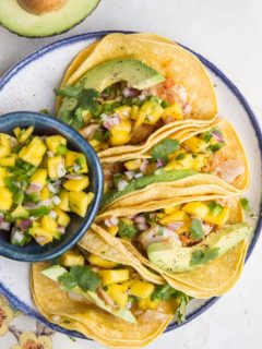 Easy Fish Tacos with Mango Salsa - fresh, delicious fish tacos made with baked cod. Super quick and delicious!