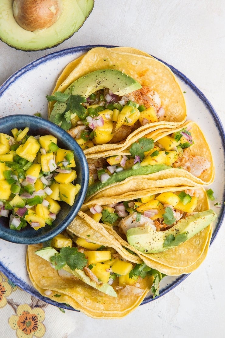 Easy Fish Tacos with Mango Salsa - fresh, delicious fish tacos made with baked cod. Super quick and delicious!