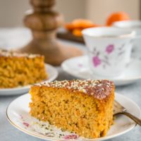 close up slice of paleo clementine cake on a fancy plate