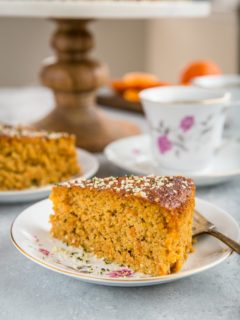 close up slice of paleo clementine cake on a fancy plate